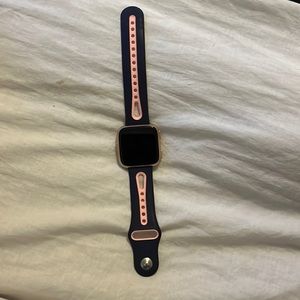 FIT BIT VERSA (GEN 1) pink and blue band. Gold frame
